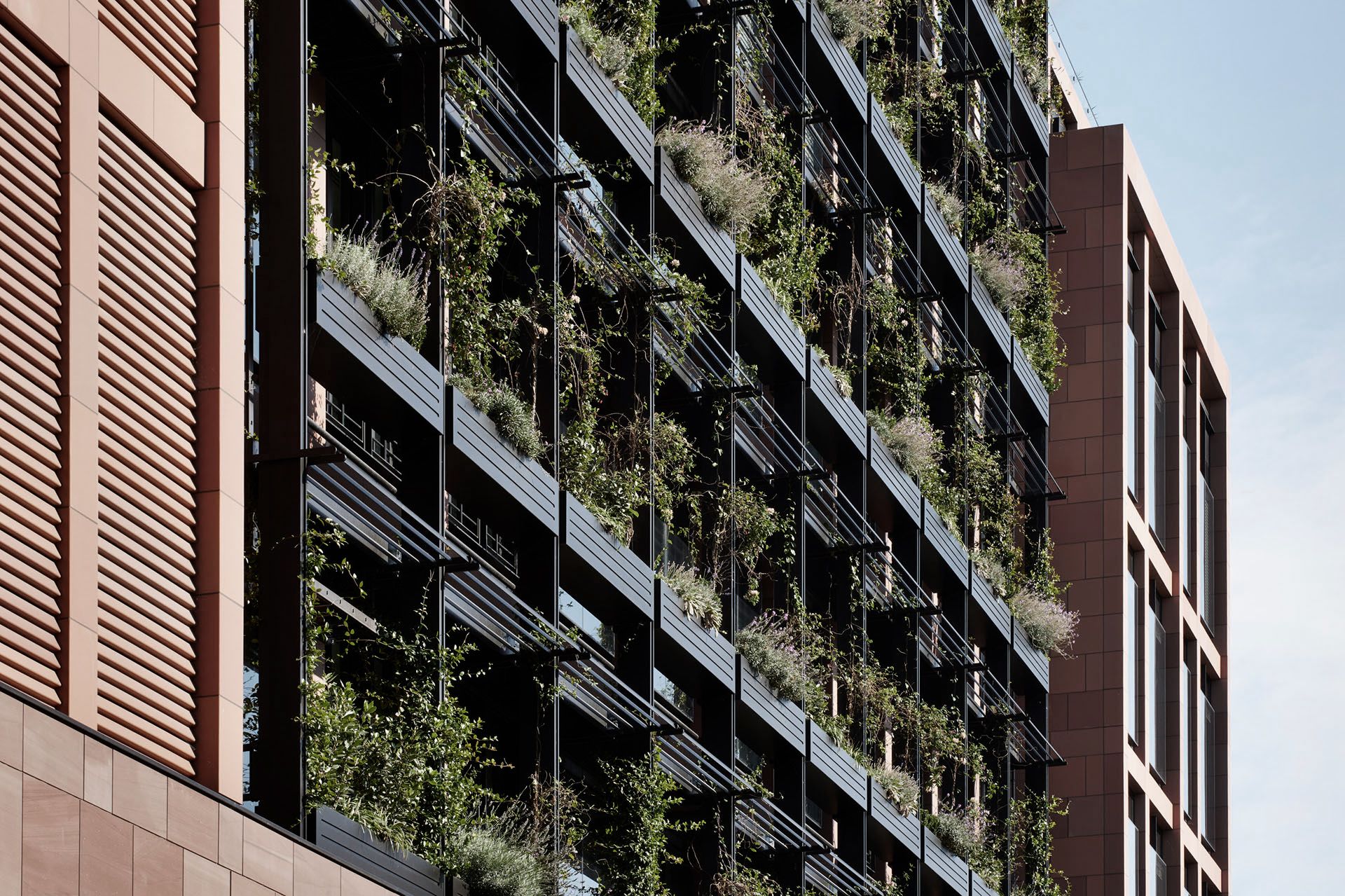 Exterior view of the Mayfair London headquarters, showcasing the IOC workspace project with modern office design integrating glass partition walls.