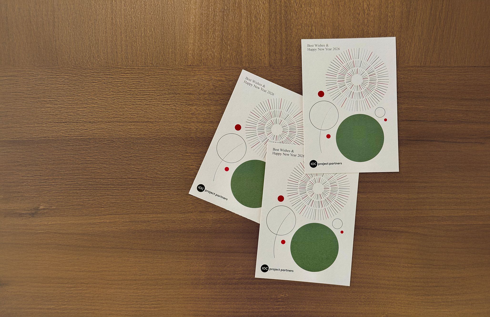 Christmas cards with “Best Wishes and Happy Year 2026,” representing IOC project partners’ appreciation and holiday greetings to clients.